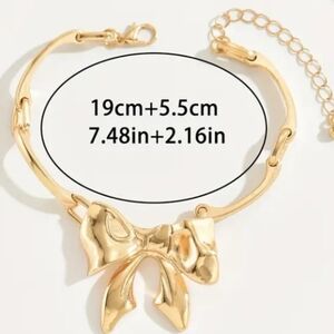 Gold Tone Bow Bracelet